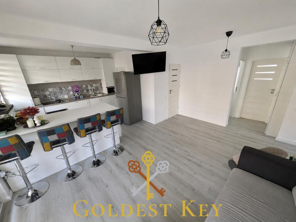Apartament cu 4 camere, terasă, curte si 2 parcări la intrare în Baciu
